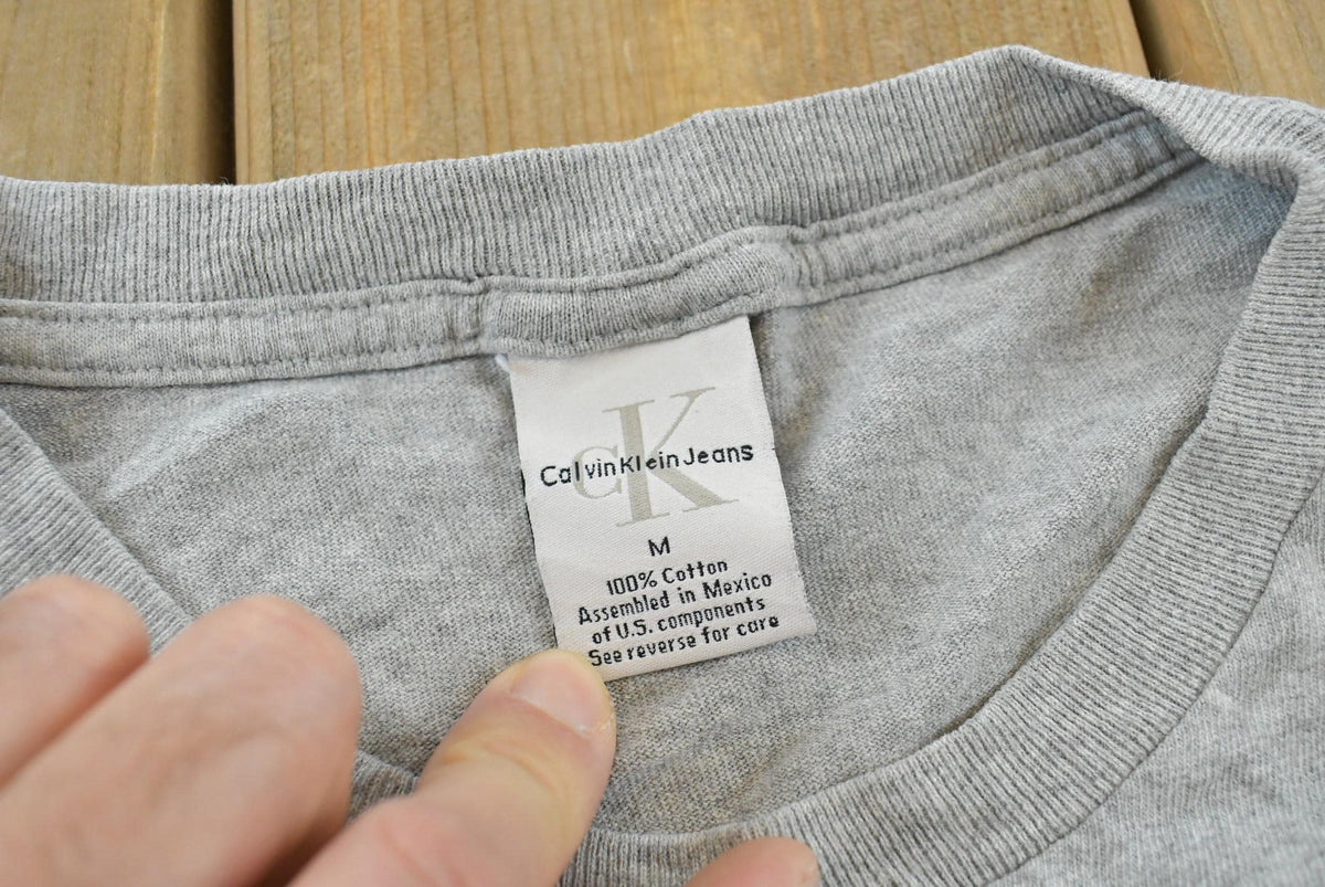 Vintage 1990s Calvin Klein Jeans Logo Graphic T-Shirt Men's XL
