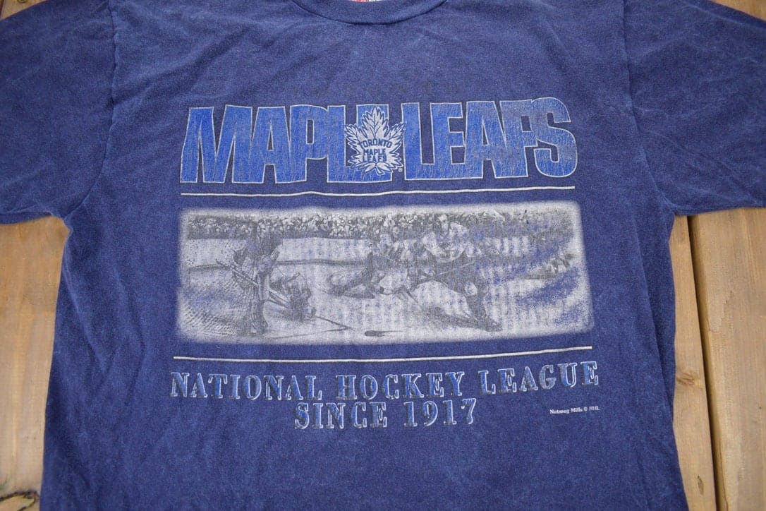 CCM Clothing > Gender Neutral Adult Clothing > Tops & Tees > T Shirts Vintage 1990s NHL Nutmeg Toronto Maple Leafs T-Shirt Made In Canada Men's Large