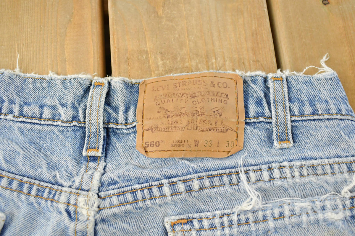 Vintage 1990s Distressed Levi's 560 Loose Fit Denim Blue Jeans Men's 32 x 26.5
