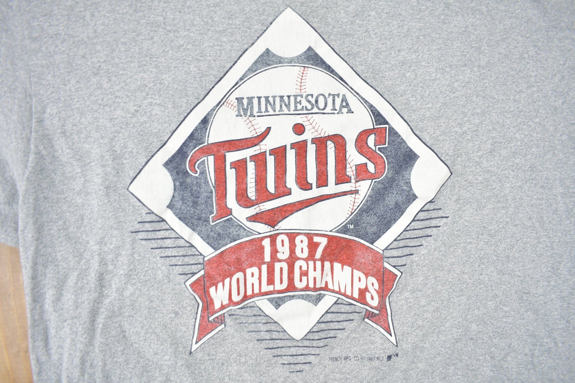 MLB Clothing > Gender Neutral Adult Clothing > Tops & Tees > T Shirts Vintage 1987 Minnesota Twins MLB World Champions Graphic T-Shirt Men's Medium