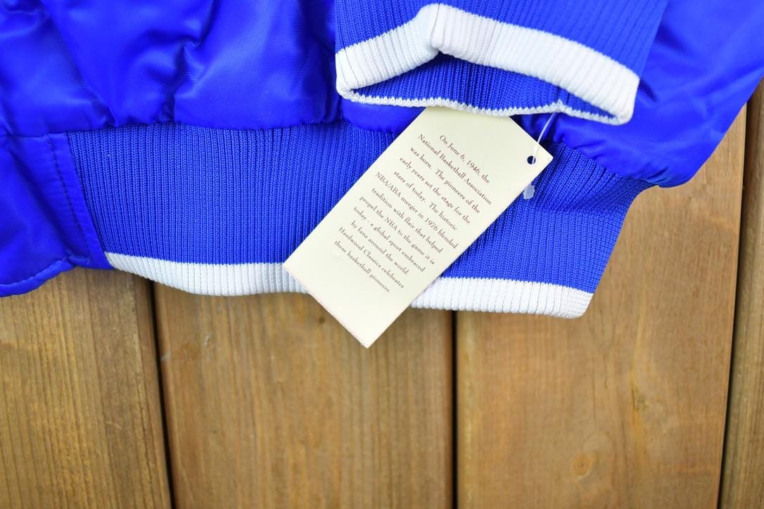 NBA Clothing > Gender Neutral Adult Clothing > Jackets & Coats Vintage 1990s Deadstock NBA Hardwood Classics Philadelphia 76ers Satin Button Up Windbreaker Basketball Jacket