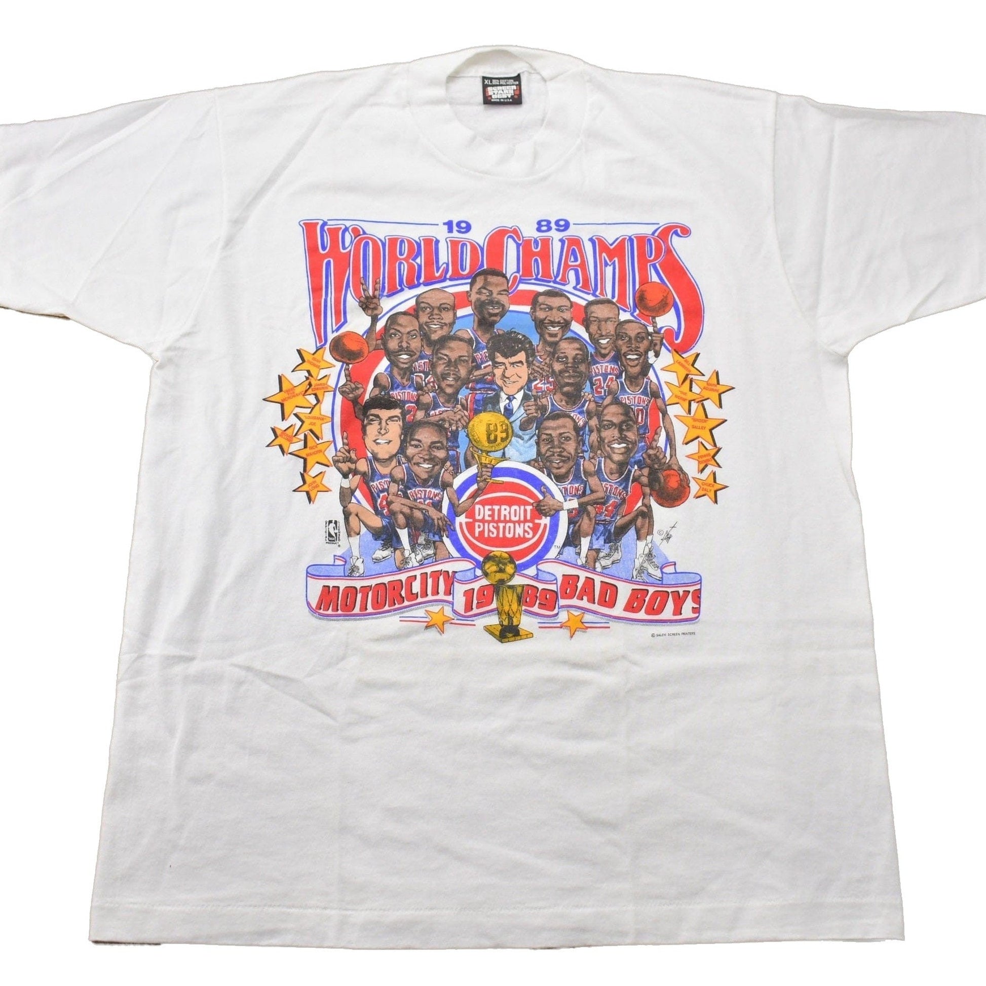 NBA Clothing > Gender Neutral Adult Clothing > Tops & Tees > T Shirts Vintage 1989 Detroit Pistons NBA World Champs Big Head Graphic T-Shirt Men's Large/ Made In USA / Single Stitch / NBA Basketball / Motor City Bad Boys