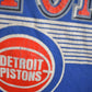 NBA Clothing > Gender Neutral Adult Clothing > Tops & Tees > T Shirts Vintage 1990s Detroit Pistons NBA Graphic T-Shirt / Made In USA / Single Stitch / NBA Basketball
