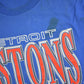 NBA Clothing > Gender Neutral Adult Clothing > Tops & Tees > T Shirts Vintage 1990s Detroit Pistons NBA Graphic T-Shirt / Made In USA / Single Stitch / NBA Basketball