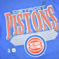 NBA Clothing > Gender Neutral Adult Clothing > Tops & Tees > T Shirts Vintage 1990s Detroit Pistons NBA Graphic T-Shirt / Made In USA / Single Stitch / NBA Basketball