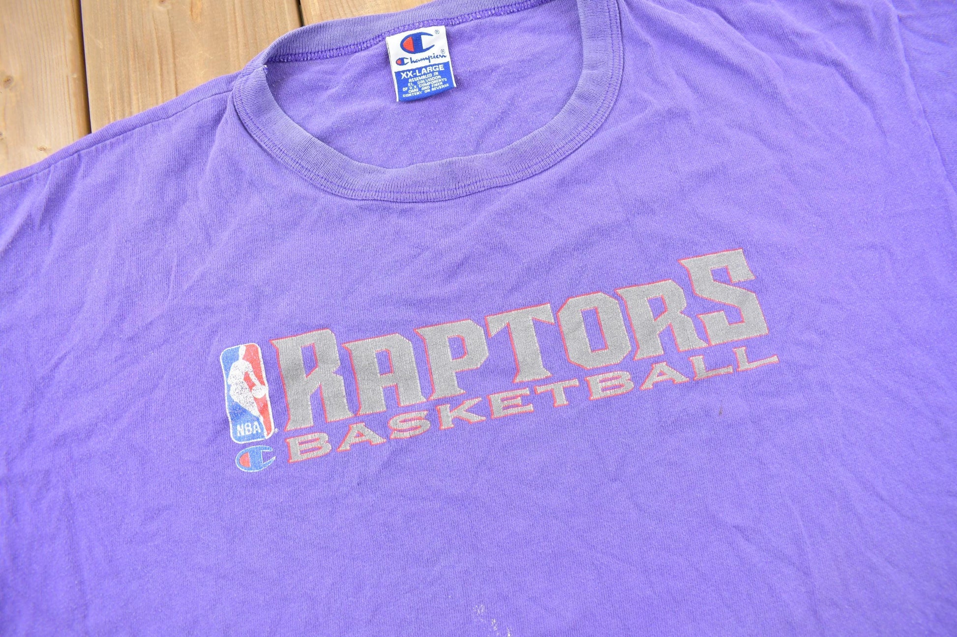 NBA Clothing > Gender Neutral Adult Clothing > Tops & Tees > T Shirts Vintage 1990s Toronto Raptors NBA Basketball Champion Graphic T-Shirt / XXL / Sportswear / Vintage NBA