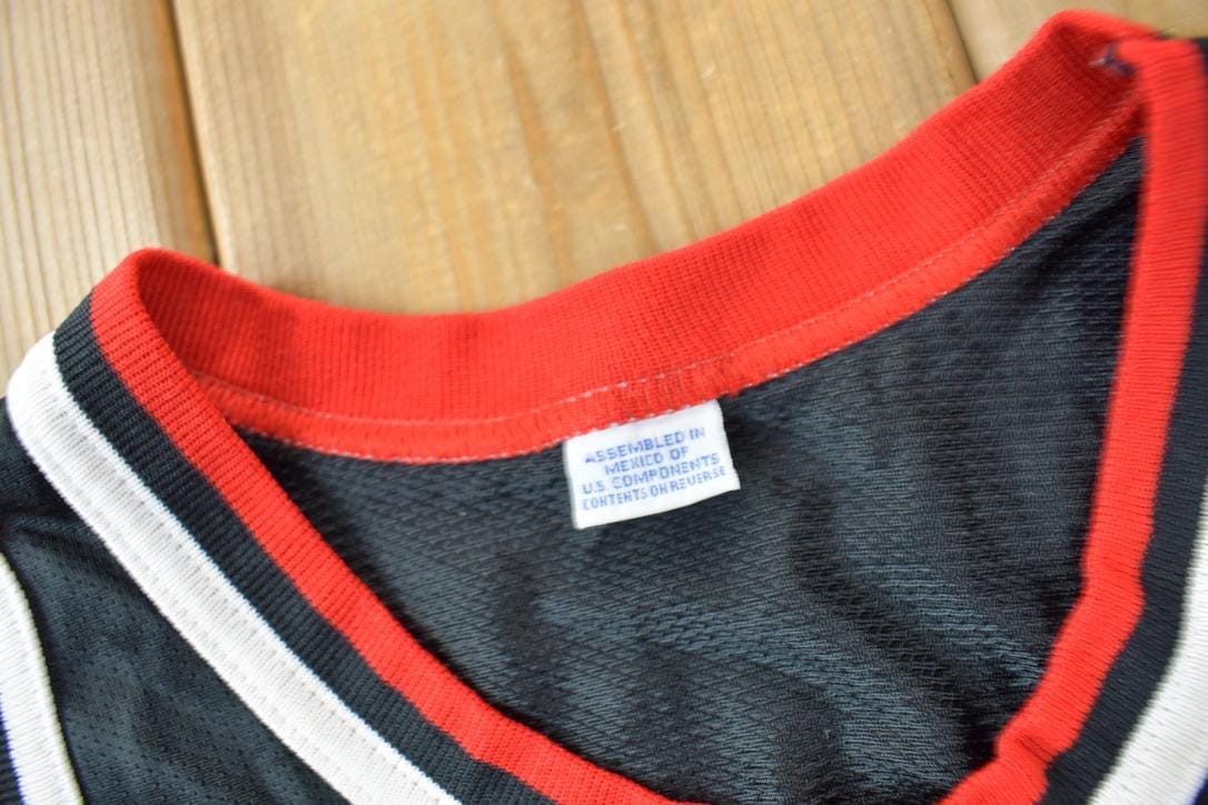 NBA Clothing > Men's Clothing > Sports & Fitness Vintage 1990s Michael Jordan Chicago Bulls NBA Champion Youth Sized Jersey / 90s NBA Jersey / Chicago Bulls Sportswear