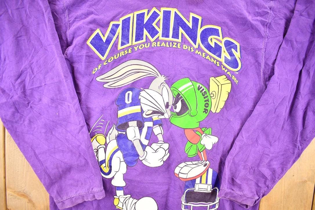 NFL Clothing > Gender Neutral Adult Clothing > Hoodies & Sweatshirts > Sweatshirts Vintage 1993 Vikings Bugs Bunny Marvin The Martian NFL Cartoon Crewneck Sweatshirt Men's S