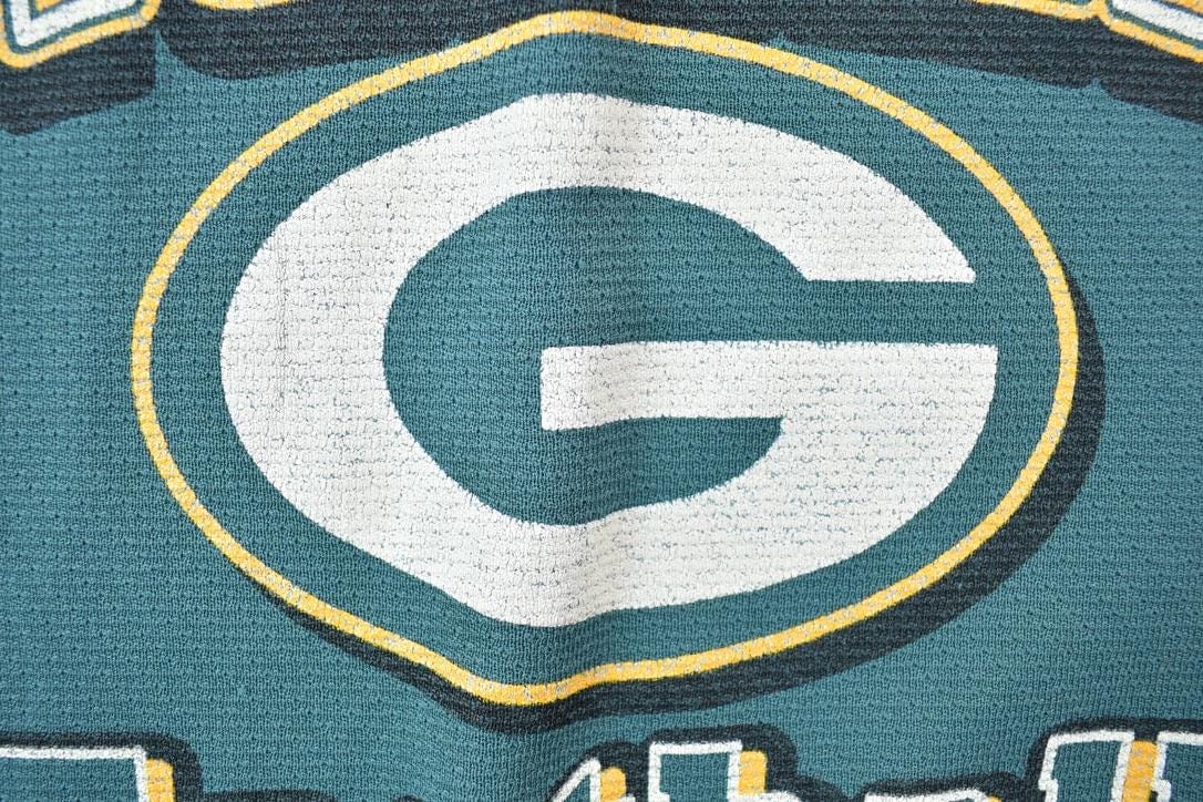 NFL Clothing > Gender Neutral Adult Clothing > Tops & Tees > T Shirts Vintage 1980s Green Bay Packers NFL Graphic T-Shirt Youth M