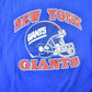NFL Clothing > Gender Neutral Adult Clothing > Tops & Tees > T Shirts Vintage 1980s New York Giants NFL T-shirt Men's Large