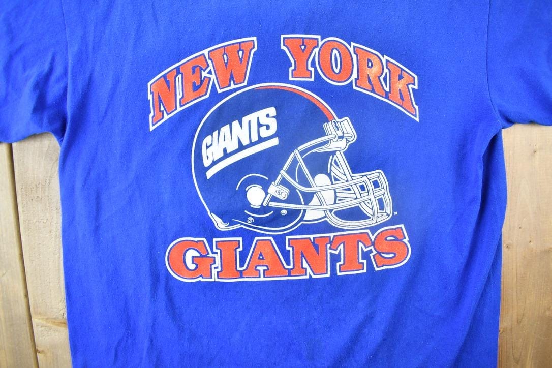 NFL Clothing > Gender Neutral Adult Clothing > Tops & Tees > T Shirts Vintage 1980s New York Giants NFL T-shirt Men's Large