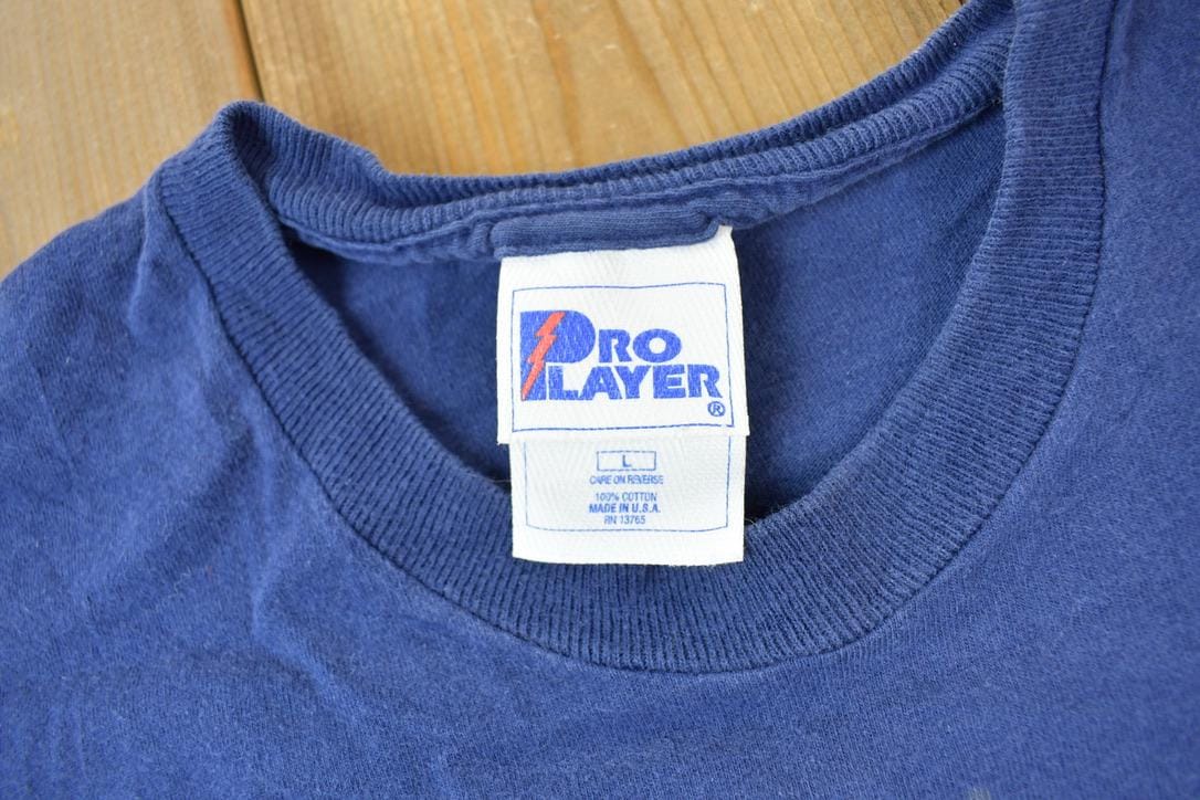 NFL Clothing > Gender Neutral Adult Clothing > Tops & Tees > T Shirts Vintage 1990a New England Patriots Pro Player Sportswear Graphic T-shirt Men's Large