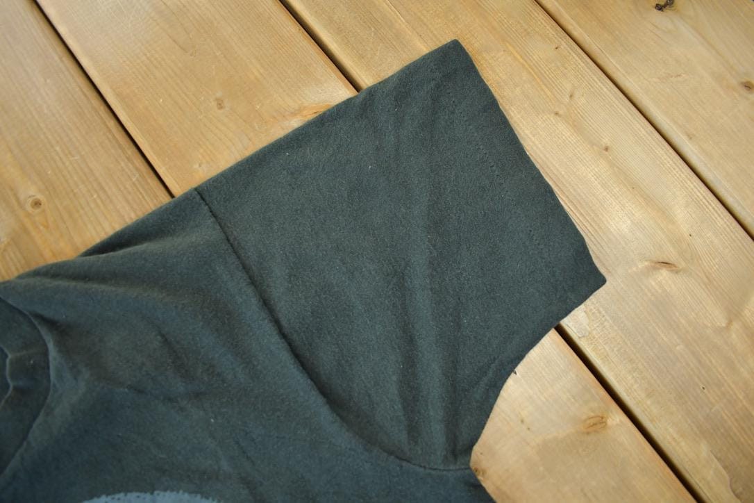 NFL Clothing > Gender Neutral Adult Clothing > Tops & Tees > T Shirts Vintage 1990s Buffalo Bills NFL Graphic T-Shirt Men's Small