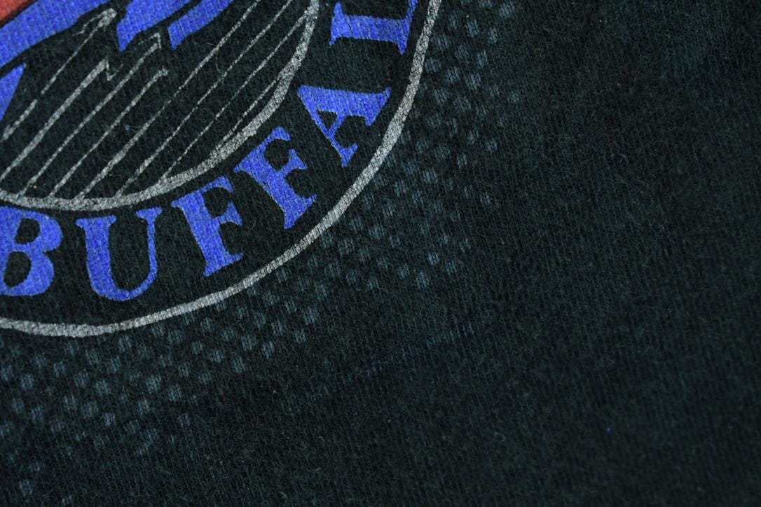 NFL Clothing > Gender Neutral Adult Clothing > Tops & Tees > T Shirts Vintage 1990s Buffalo Bills NFL Graphic T-Shirt Men's Small