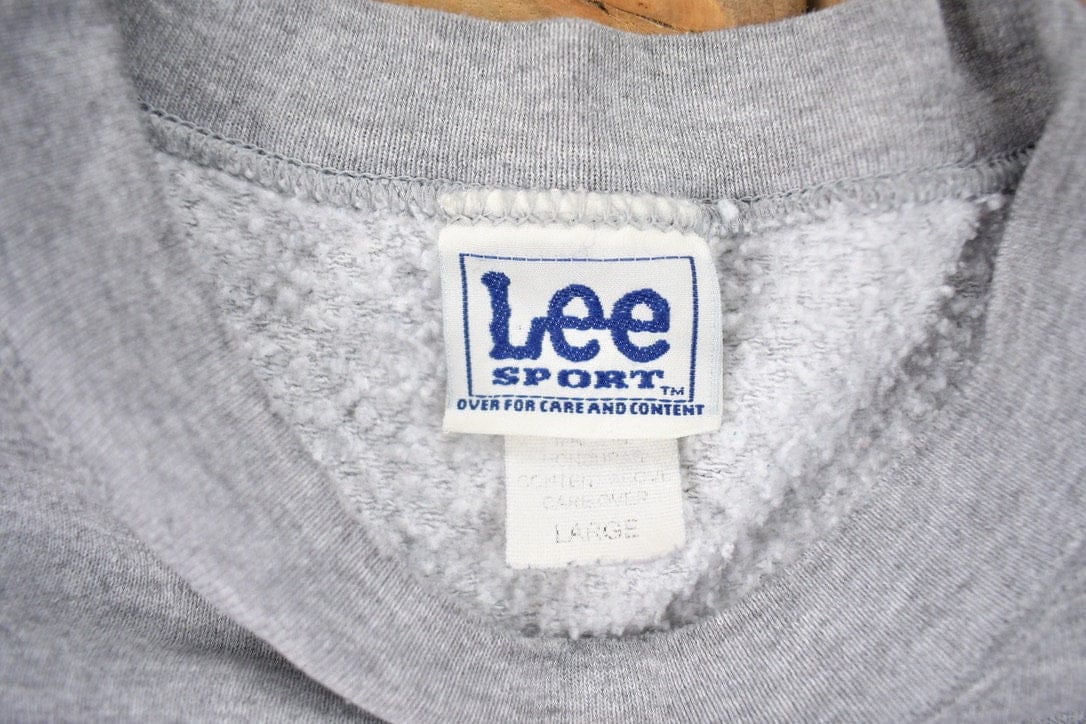 NHL Clothing > Gender Neutral Adult Clothing > Hoodies & Sweatshirts > Sweatshirts Vintage 1990s Lee Sport Chicago Blackhawks NHL Crewneck Sweatshirt Men's Large