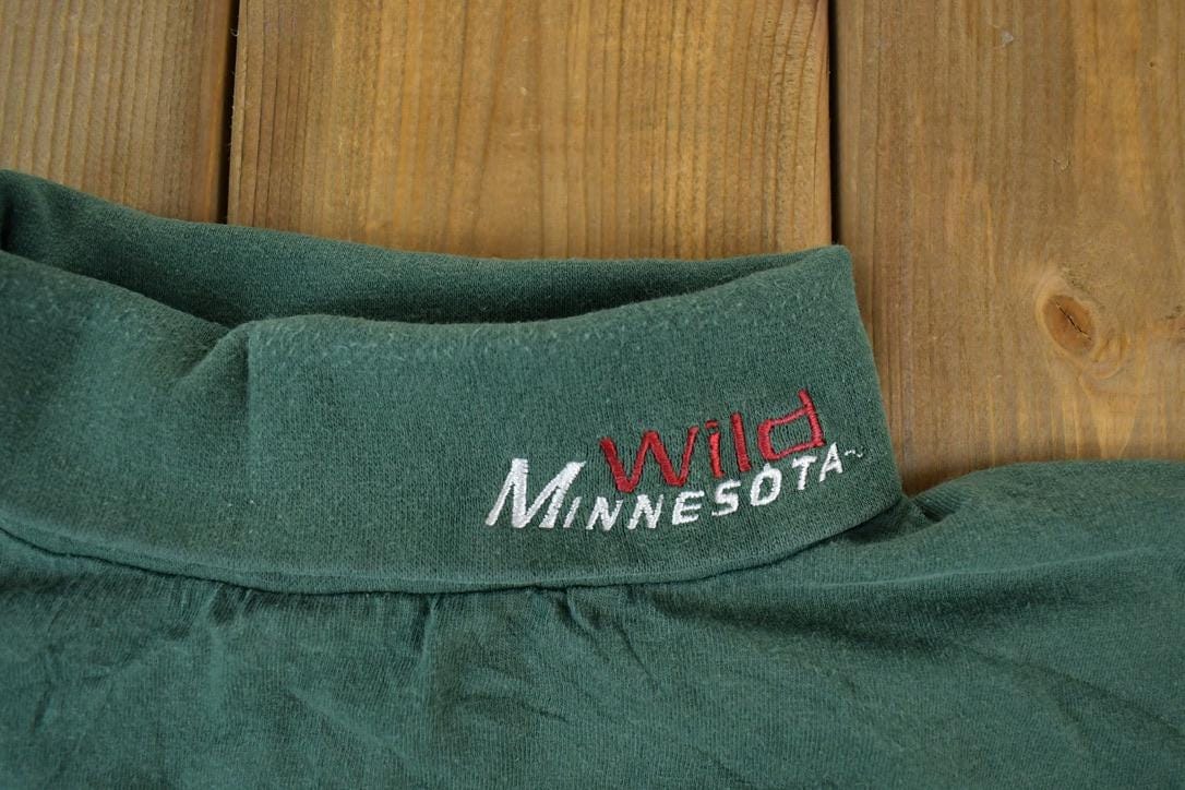 NHL Clothing > Gender Neutral Adult Clothing > Hoodies & Sweatshirts > Sweatshirts Vintage 1990s Minnesota Wild Turtleneck NHL Hockey Sweatshirt Men's Large