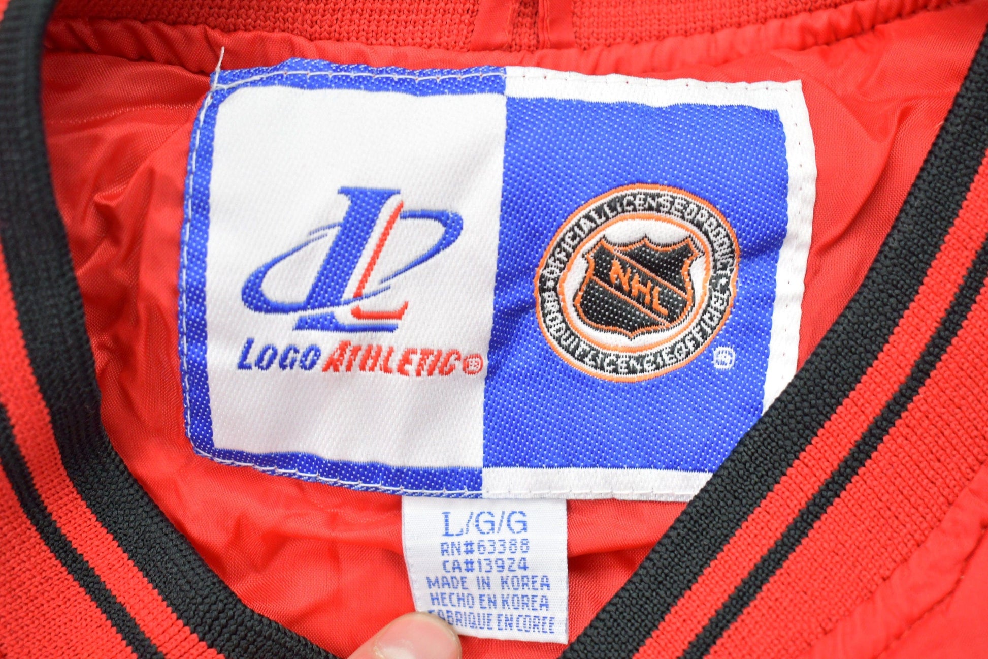 NHL Clothing > Gender Neutral Adult Clothing > Jackets & Coats Vintage 1990s Detroit Red Wings NHL Windbreaker Pullover Jacket Men's Large