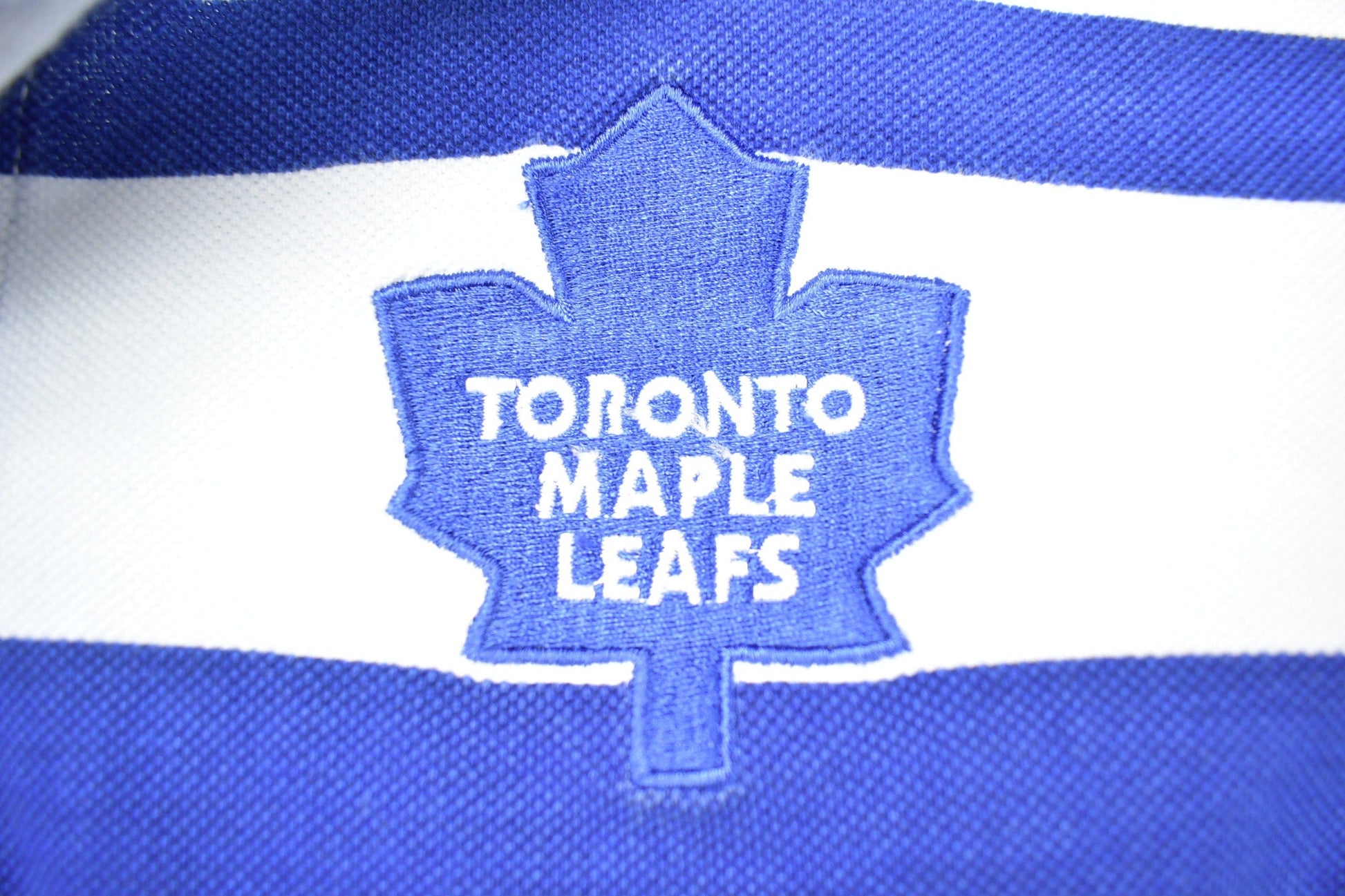 NHL Clothing > Gender Neutral Adult Clothing > Tops & Tees > T Shirts Vintage 1990s NHL Toronto Maple Leafs Striped Collared Shirt Men's Small