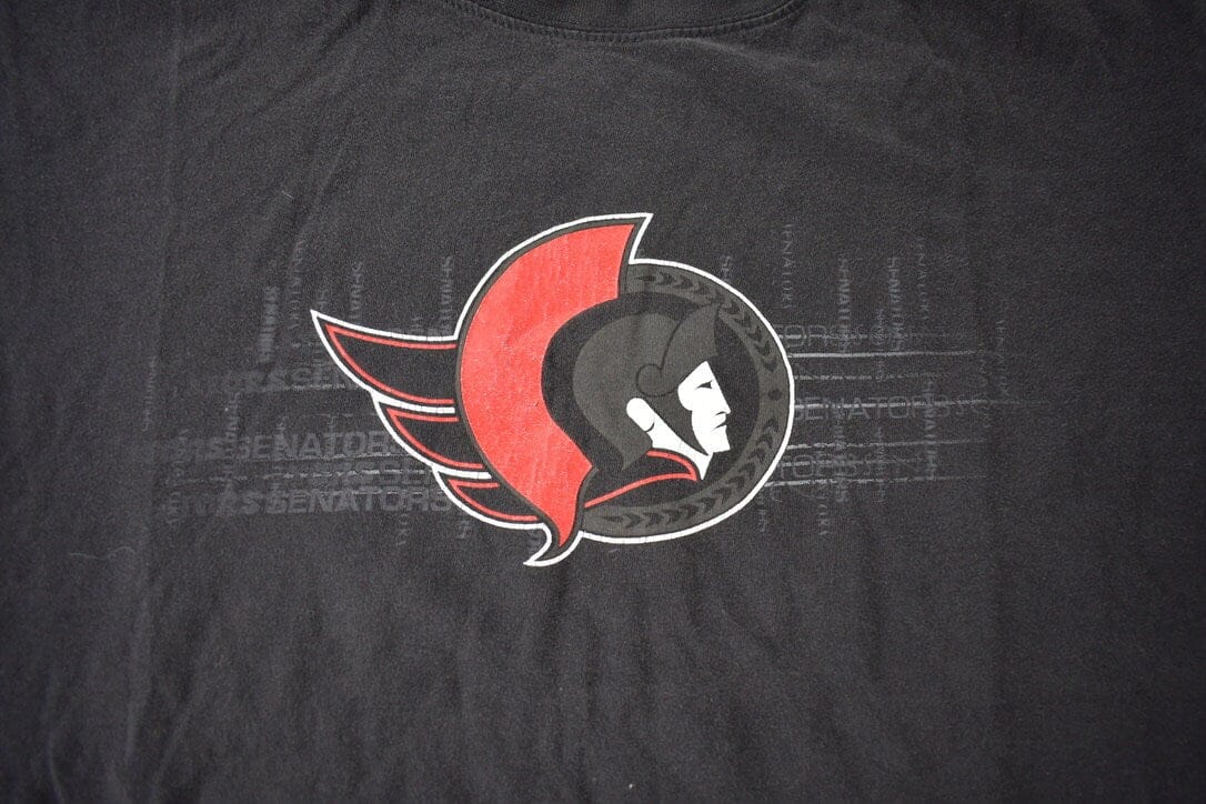 NHL Clothing > Gender Neutral Adult Clothing > Tops & Tees > T Shirts Vintage 1990s Ottawa Senators NHL Hockey Graphic T-Shirt