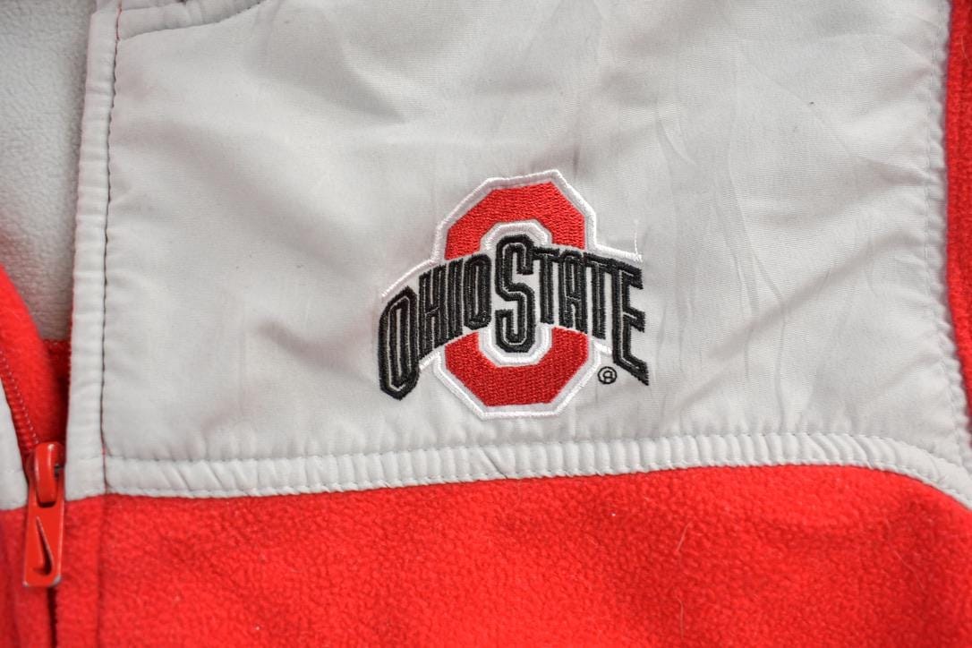 Nike Clothing > Gender Neutral Adult Clothing > Hoodies & Sweatshirts > Sweatshirts Vintage 1990s Ohio State University Buckeyes Collegiate Zip Up Nike Fleece Sweater Men's M