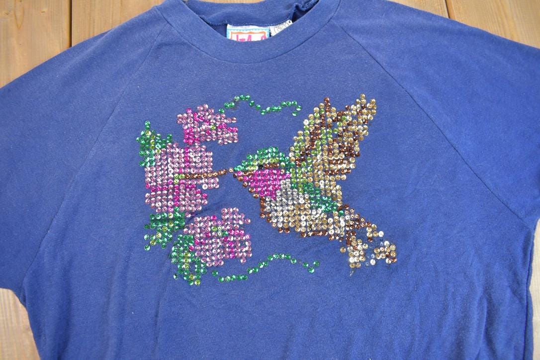 Other Clothing > Gender Neutral Adult Clothing > Hoodies & Sweatshirts > Sweatshirts Vintage 1980s Swallow Sequin Short Sleeve Raglan Crewneck Sweatshirt Women's M