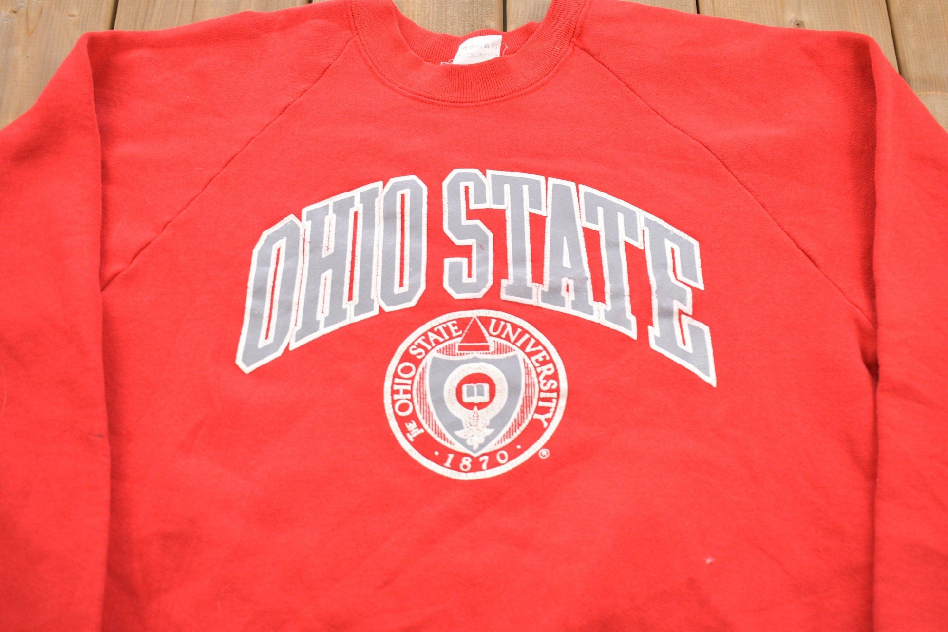 Other Clothing > Gender Neutral Adult Clothing > Hoodies & Sweatshirts > Sweatshirts Vintage 1980s University of Ohio State Buckeyes Graphic Collegiate Crewneck / Fruit Of The Loom / NCAA Sweatshirt / Sportswear / Americana