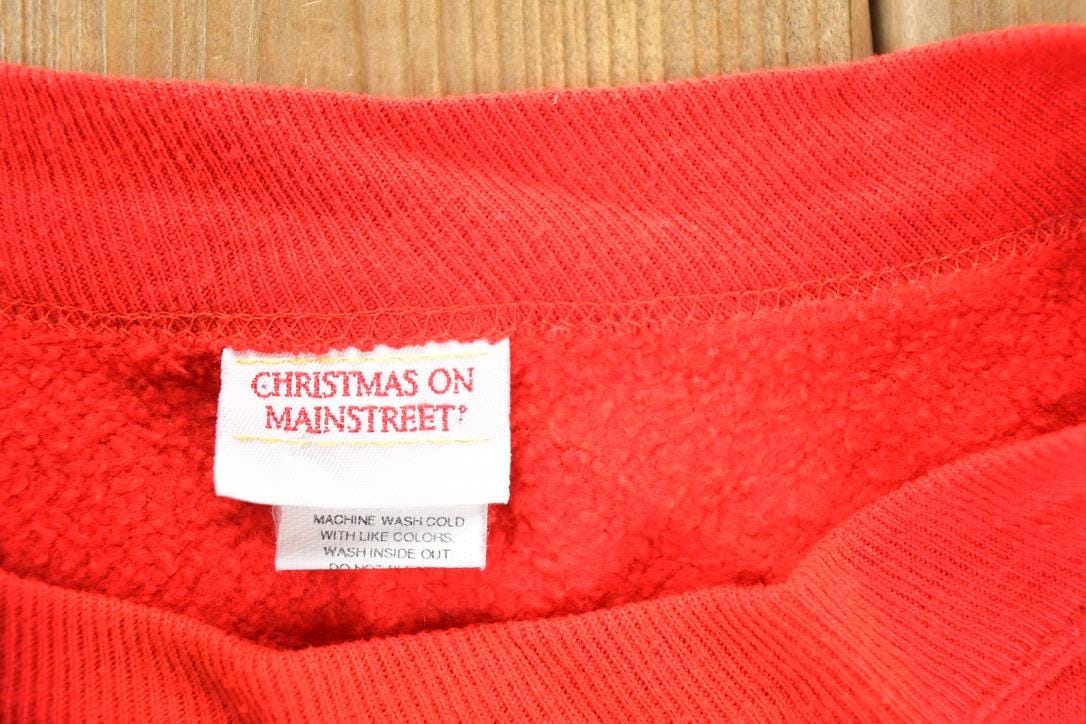 Other Clothing > Gender Neutral Adult Clothing > Hoodies & Sweatshirts > Sweatshirts Vintage 1990s Christmas On Main Street AOP Crewneck Sweatshirt Mens L