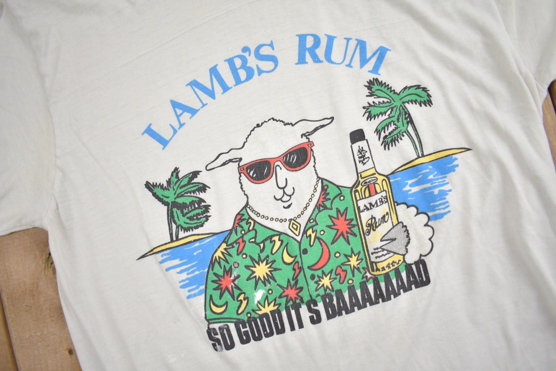 Other Clothing > Gender Neutral Adult Clothing > Tops & Tees > T Shirts Vintage 1980s Lamb's Rum "So Good Its Baaaad" Graphic T Shirt Men's M