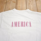 Other Clothing > Gender Neutral Adult Clothing > Tops & Tees > T Shirts Vintage 1990s America Graphic T Shirt Men's Medium