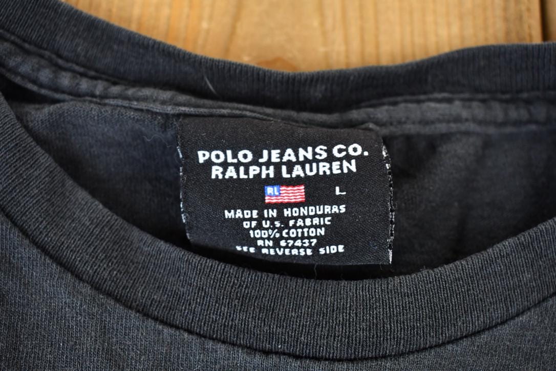 Polo Clothing > Gender Neutral Adult Clothing > Tops & Tees > T Shirts Vintage 1990s Polo Ralph Lauren Jeans Company Graphic T-Shirt Men's Large