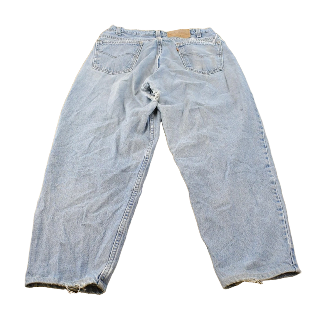 Vintage 1990s Distressed Levi's 560 Loose Fit Denim Blue Jeans Men's 32 x 26.5