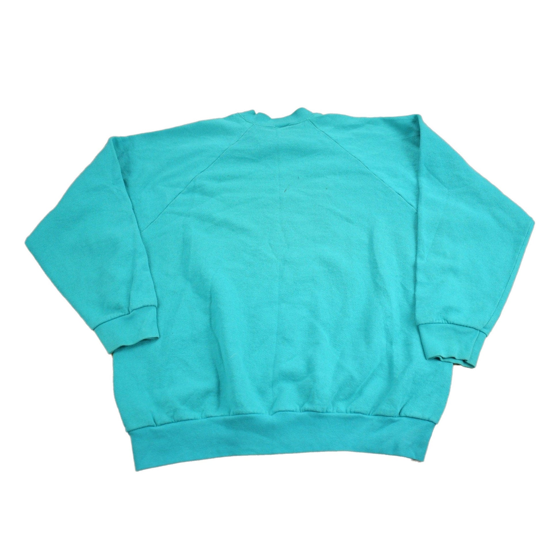 Proper Vintage Clothing > Gender Neutral Adult Clothing > Hoodies & Sweatshirts > Sweatshirts Vintage 1980s Blank Turquoise Crewneck Sweatshirt / 80s Crewneck / Essential / Streetwear / 80s Blank / Raglan Sweater / Made In USA
