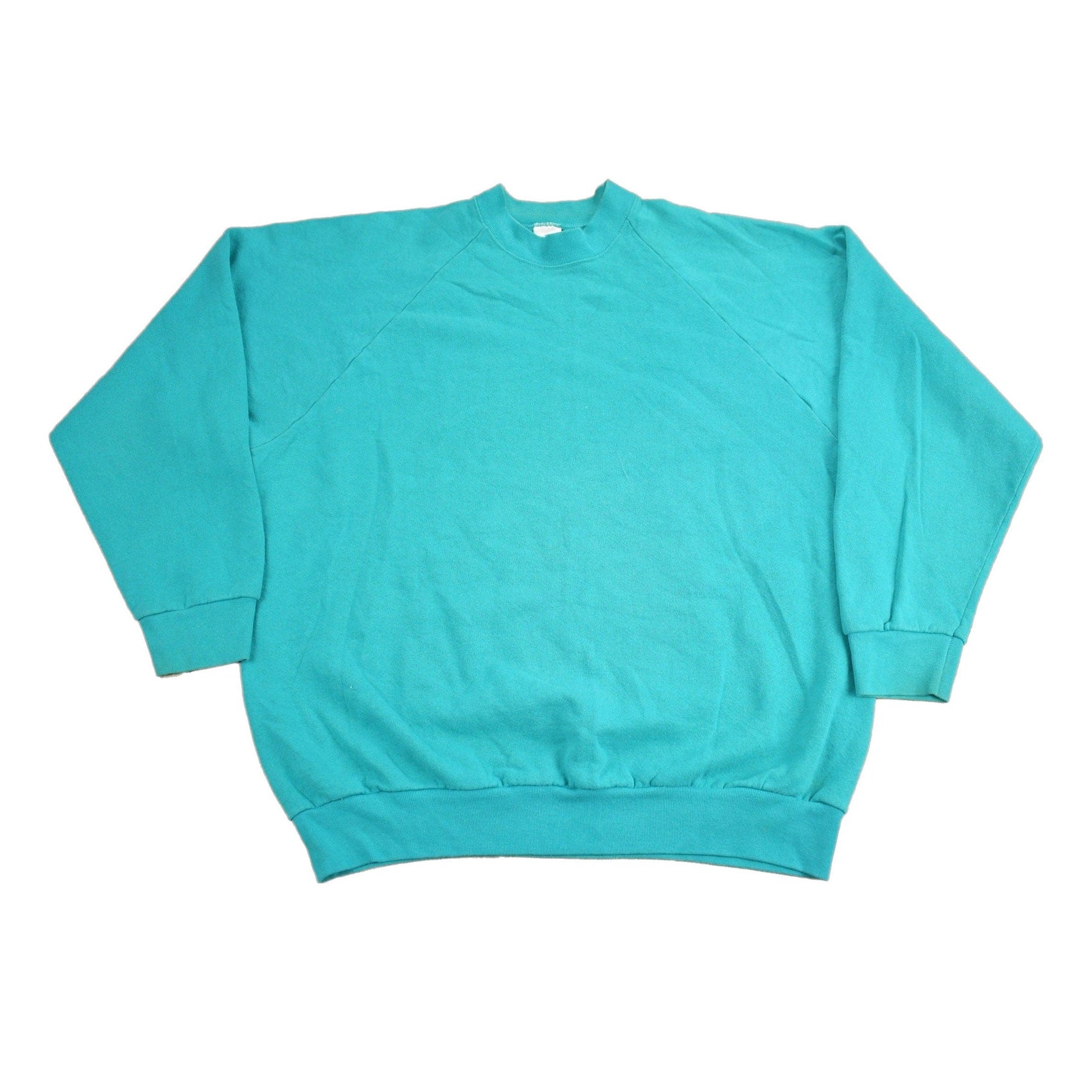 Proper Vintage Clothing > Gender Neutral Adult Clothing > Hoodies & Sweatshirts > Sweatshirts Vintage 1980s Blank Turquoise Crewneck Sweatshirt / 80s Crewneck / Essential / Streetwear / 80s Blank / Raglan Sweater / Made In USA