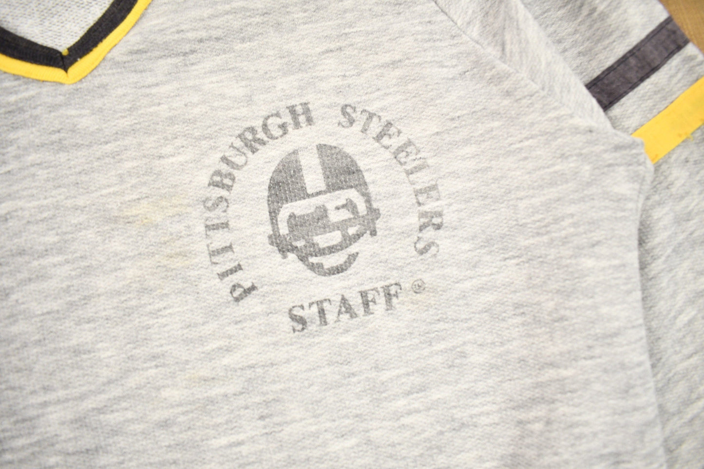 Proper Vintage Clothing > Gender Neutral Adult Clothing > Hoodies & Sweatshirts > Sweatshirts Vintage 1980s Pittsburgh Steelers NFL Staff Sweatshirt / Made In USA / Vintage Football / Sportswear / Americana / Raglan Sweater