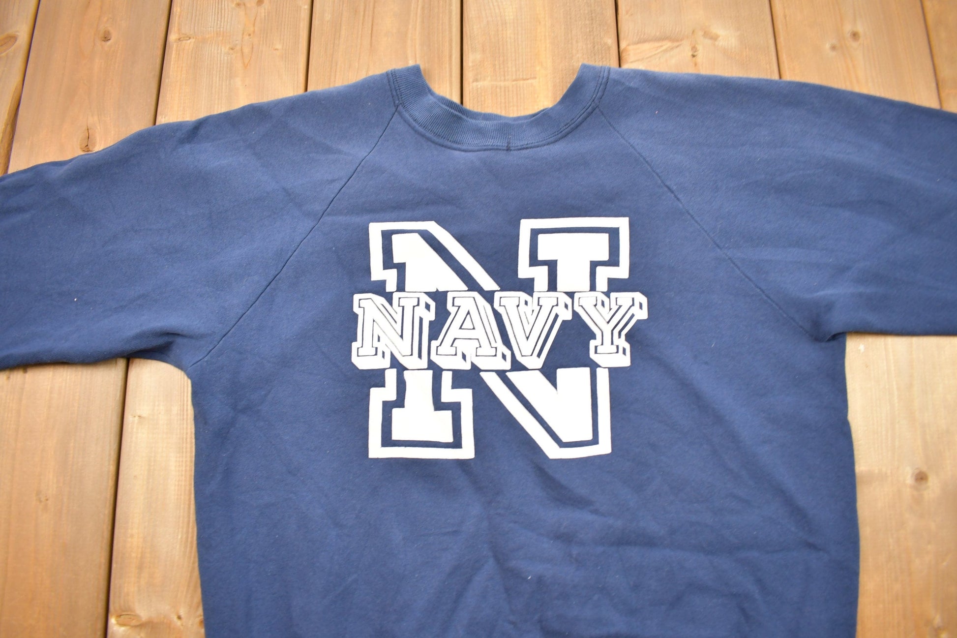 Proper Vintage Clothing > Gender Neutral Adult Clothing > Hoodies & Sweatshirts > Sweatshirts Vintage 1980s United States Navy Graphic Raglan Crewneck / Vintage Military Sweatshirt / / Navy Sweater