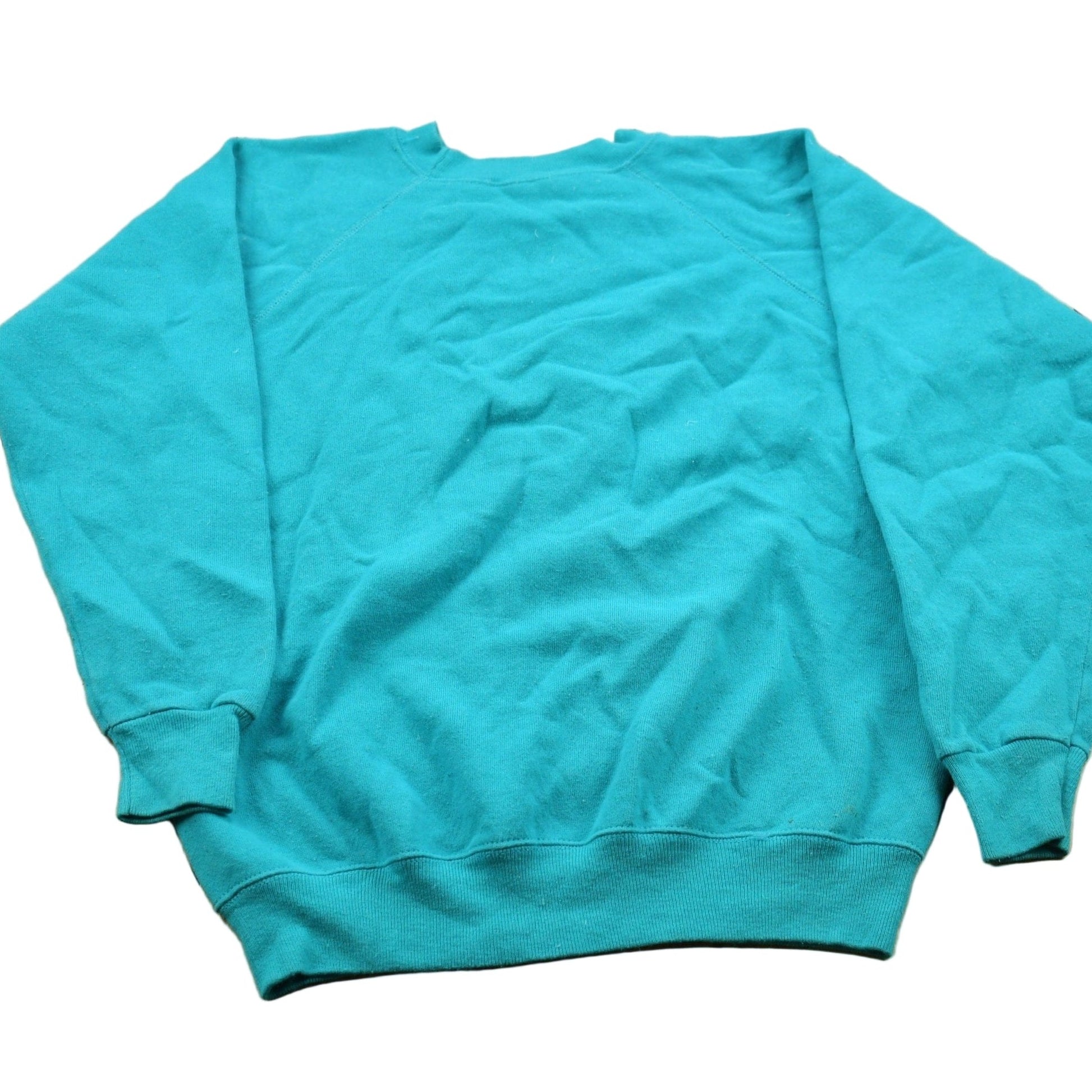 Proper Vintage Clothing > Gender Neutral Adult Clothing > Hoodies & Sweatshirts > Sweatshirts Vintage 1990s Blank Turquoise Crewneck Sweatshirt / 90s Crewneck / Made In USA / Essential / Streetwear / 90s Blank
