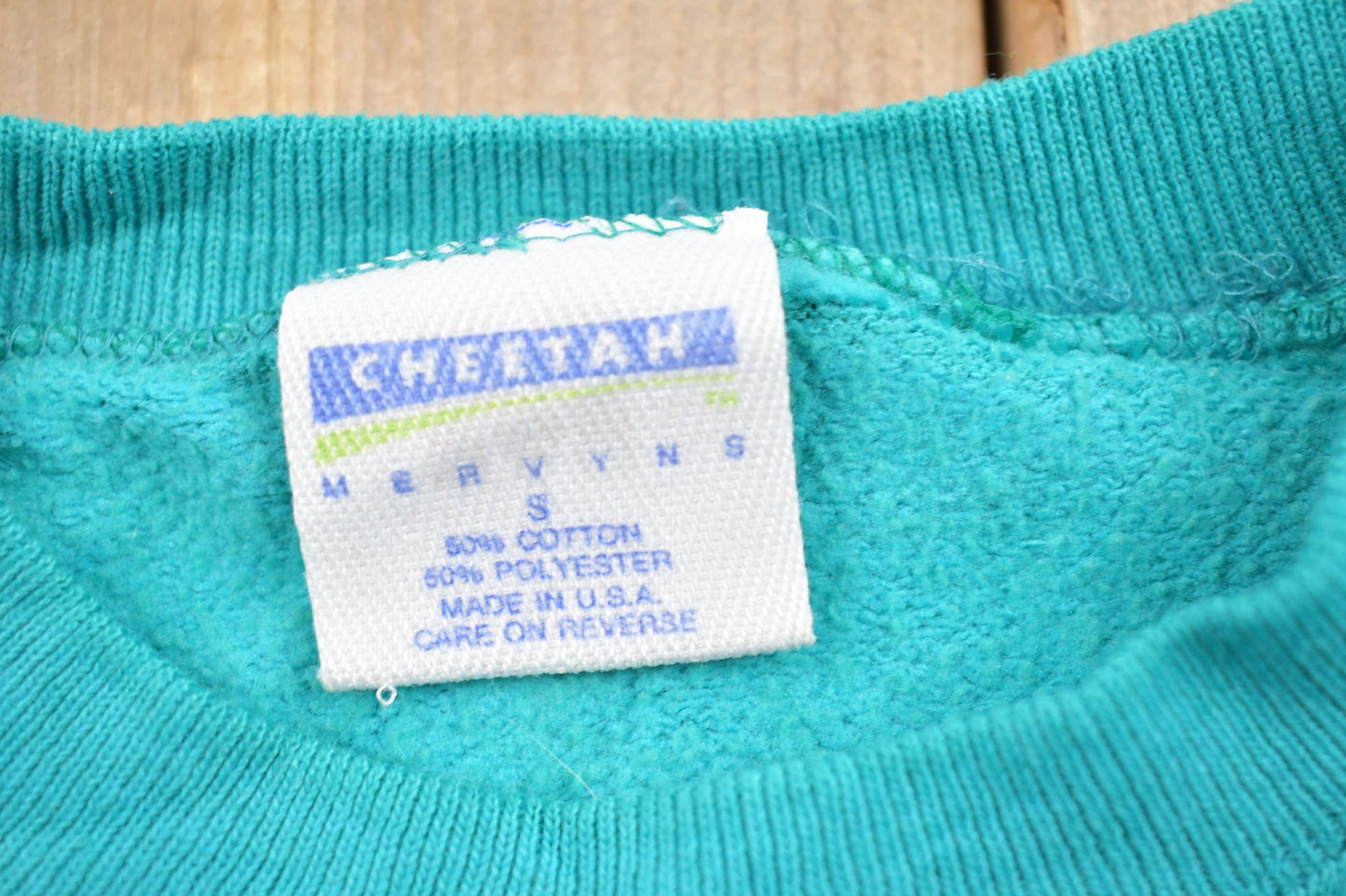 Proper Vintage Clothing > Gender Neutral Adult Clothing > Hoodies & Sweatshirts > Sweatshirts Vintage 1990s Blank Turquoise Crewneck Sweatshirt / 90s Crewneck / Made In USA / Essential / Streetwear / 90s Blank / Cheetah Mervvns