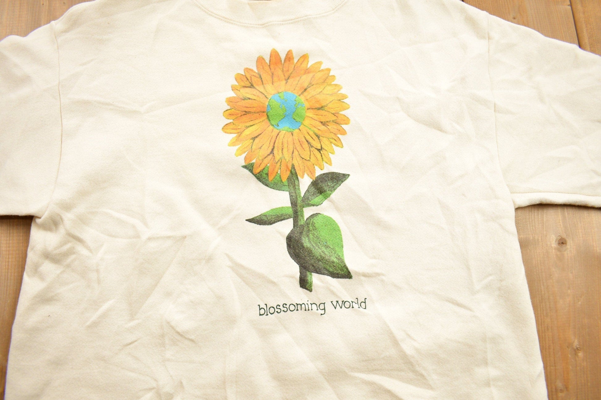 Proper Vintage Clothing > Gender Neutral Adult Clothing > Hoodies & Sweatshirts > Sweatshirts Vintage 1990s Blossoming World Die Graphic Crewneck Sweatshirt / 90s Crewneck / Made In USA / Streetwear / Sun Flower