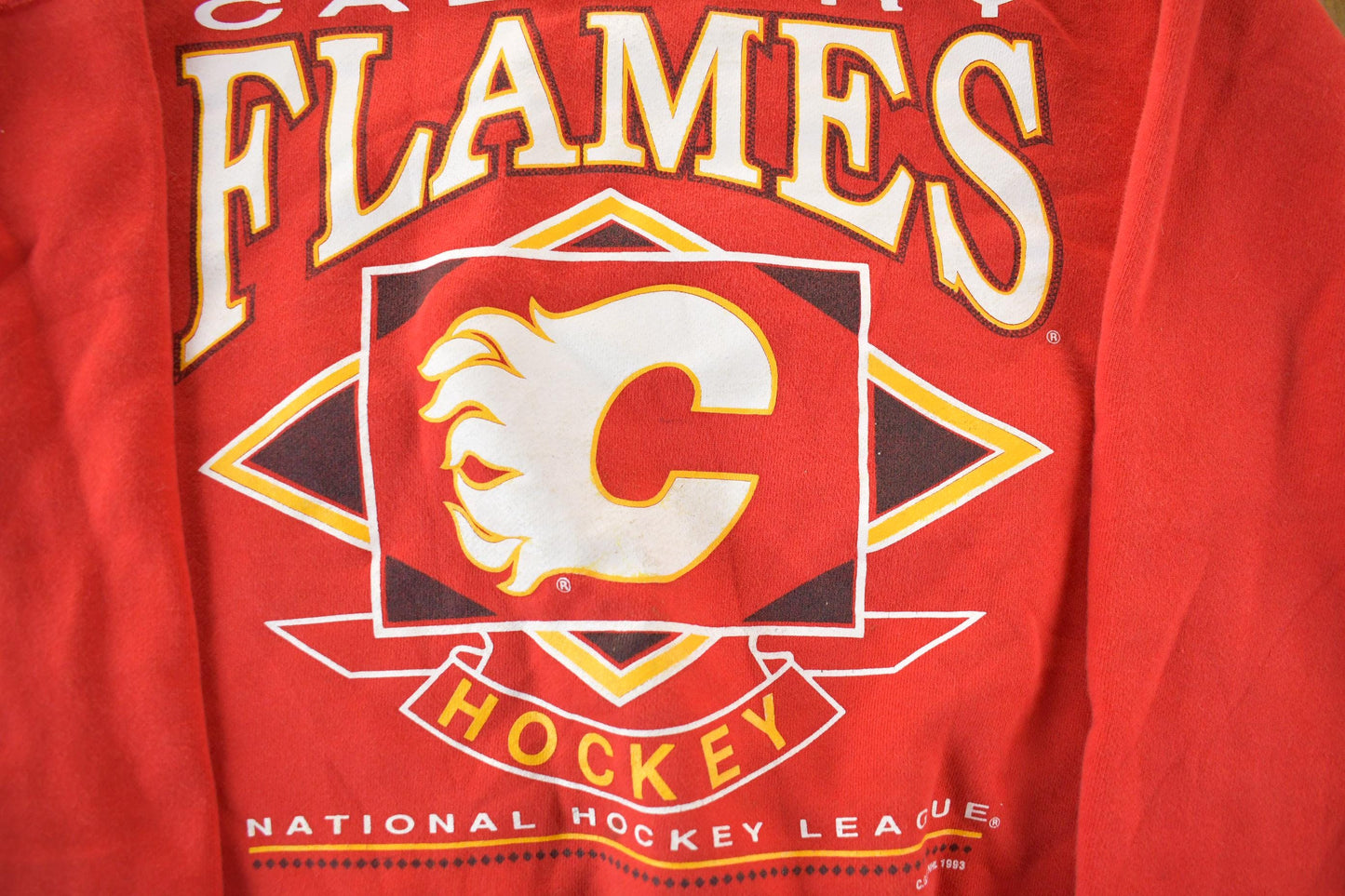 Proper Vintage Clothing > Gender Neutral Adult Clothing > Hoodies & Sweatshirts > Sweatshirts Vintage 1990s Calgary Flames NHL Hockey Crewneck Sweatshirt / Made In USA / Vintage Sportswear / Embroidered / Men's XL