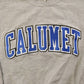 Proper Vintage Clothing > Gender Neutral Adult Clothing > Hoodies & Sweatshirts > Sweatshirts Vintage 1990s Calumet College Crewneck / Embroidered / NCAA Sweatshirt / Sportswear / Americana