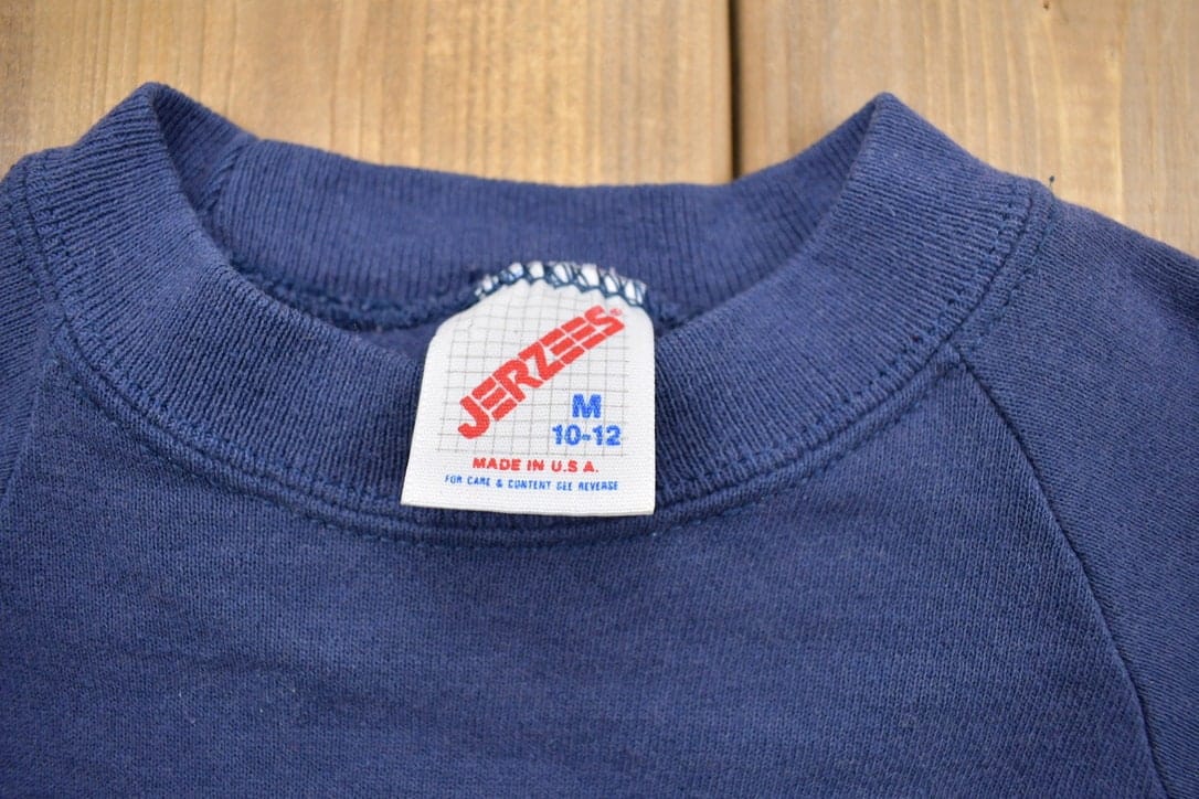 Proper Vintage Clothing > Gender Neutral Adult Clothing > Hoodies & Sweatshirts > Sweatshirts Vintage 1990s Calumet College Crewneck Sweatshirt Youth M / NCAA Sweatshirt / Sportswear / Americana