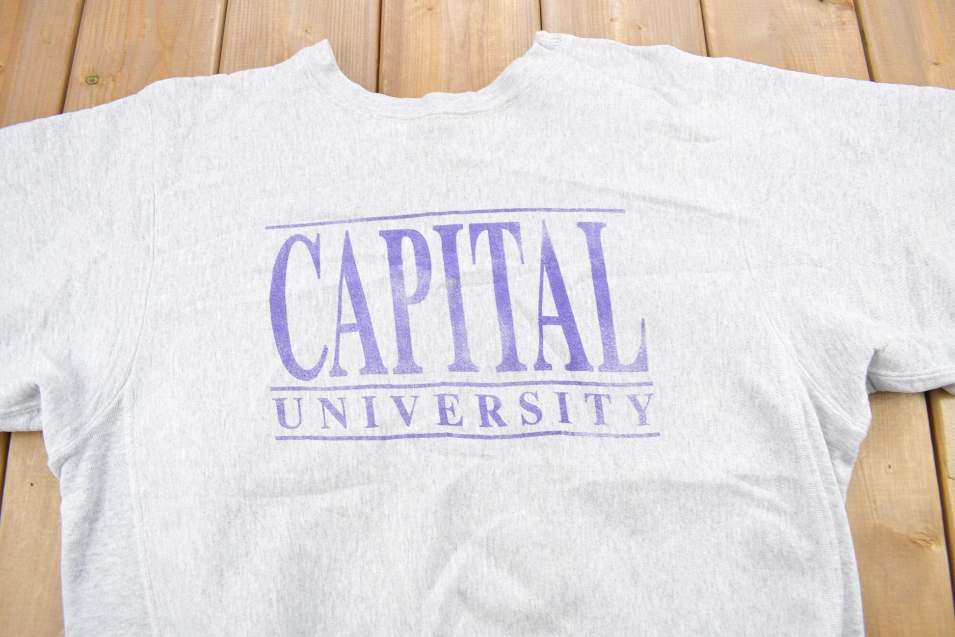 Proper Vintage Clothing > Gender Neutral Adult Clothing > Hoodies & Sweatshirts > Sweatshirts Vintage 1990s Capital University Collegiate Crewneck / The Cotton Exchange / NCAA Sweatshirt / Sportswear / Americana