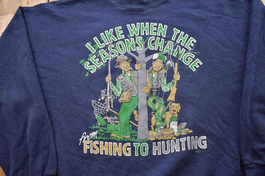Proper Vintage Clothing > Gender Neutral Adult Clothing > Hoodies & Sweatshirts > Sweatshirts Vintage 1990s Fishing And Hunting Crewneck / Souvenir / Vintage Sweatshirt / Outdoorsman / Wilderness Sweatshirt / Made In USA / Seasons