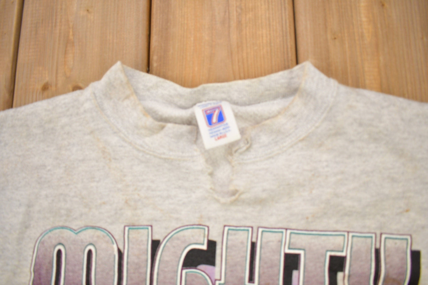 Proper Vintage Clothing > Gender Neutral Adult Clothing > Hoodies & Sweatshirts > Sweatshirts Vintage 1990s Mighty Ducks Of Anaheim NHL Logo 7 Crewneck Sweatshirt / Distressed / Sportswear / Athleisure / Americana / Made In USA