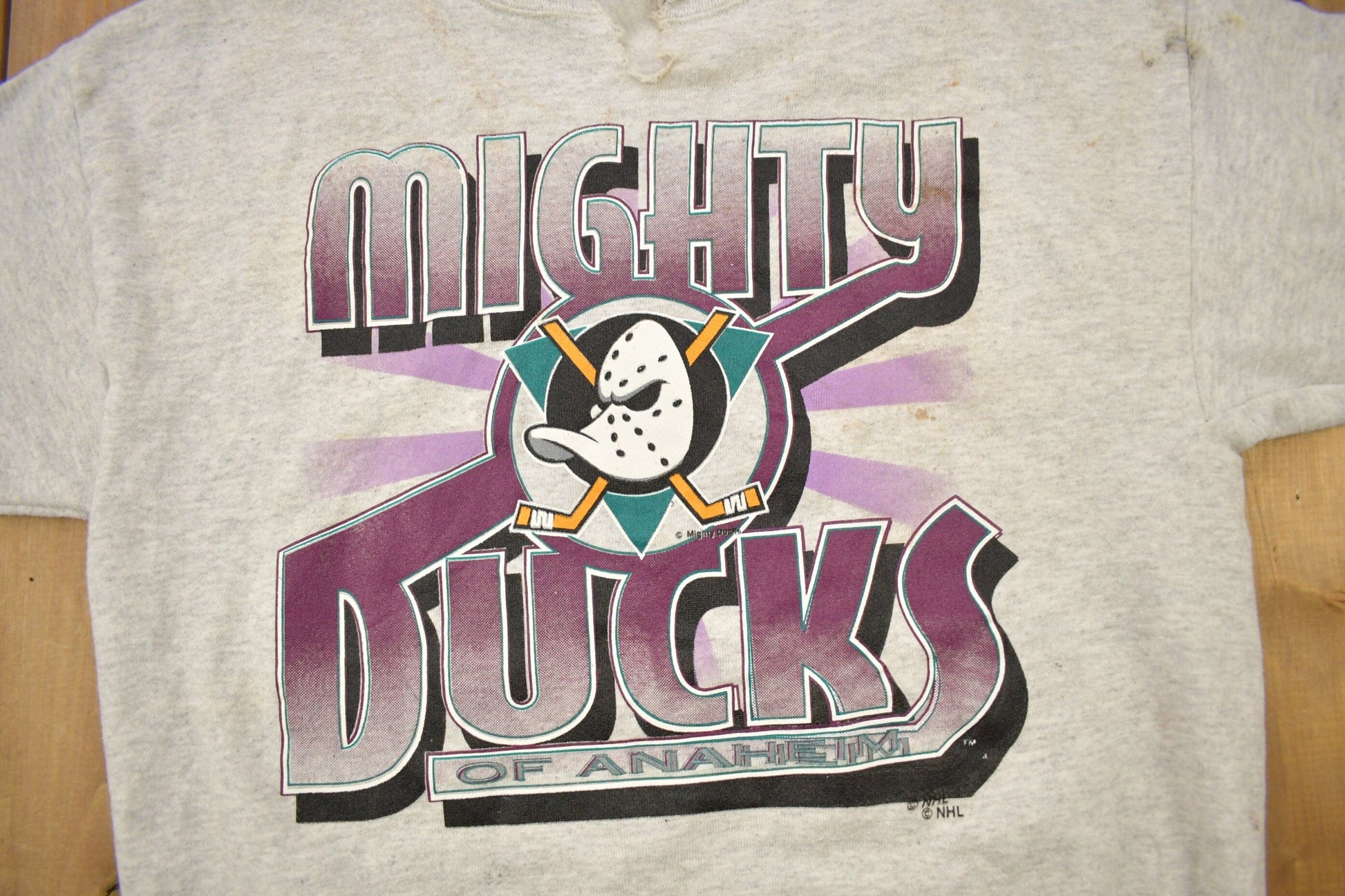 Proper Vintage Clothing > Gender Neutral Adult Clothing > Hoodies & Sweatshirts > Sweatshirts Vintage 1990s Mighty Ducks Of Anaheim NHL Logo 7 Crewneck Sweatshirt / Distressed / Sportswear / Athleisure / Americana / Made In USA