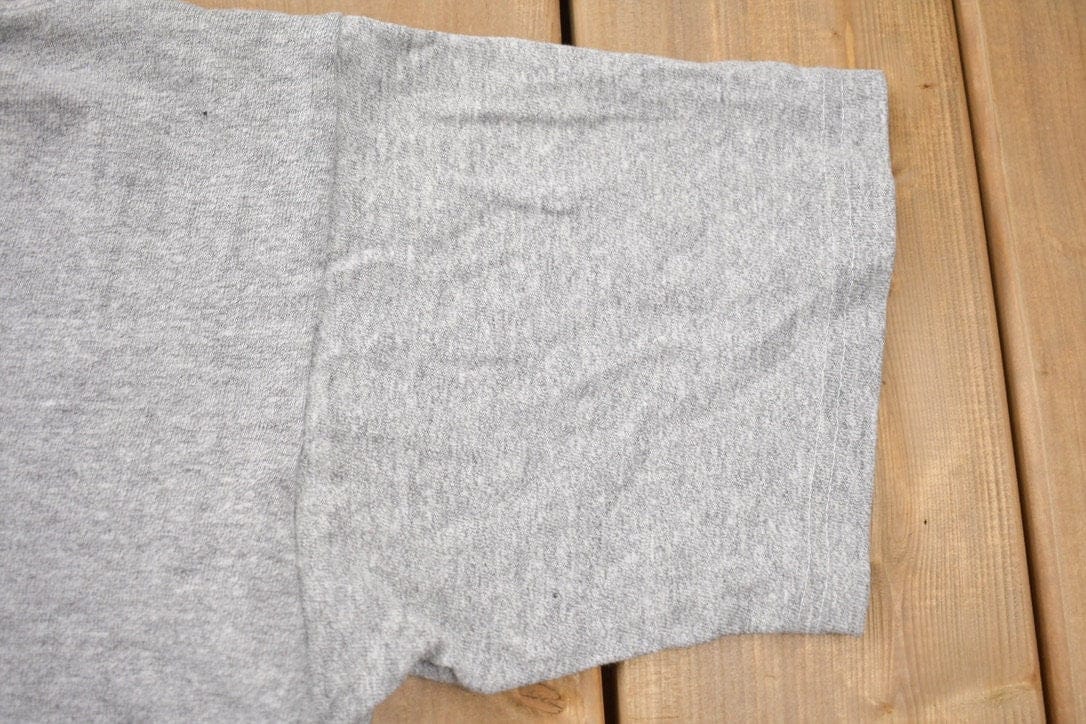 Proper Vintage Clothing > Gender Neutral Adult Clothing > Tops & Tees > T Shirts Vintage 1980s Boston Celtics Logo NBA Ravens T-Shirt / Sportswear / Basketball / Made In Canada