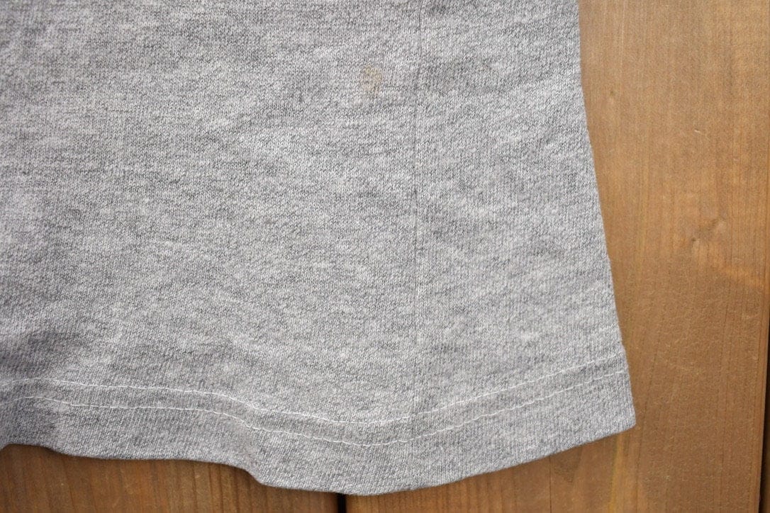 Proper Vintage Clothing > Gender Neutral Adult Clothing > Tops & Tees > T Shirts Vintage 1980s Boston Celtics Logo NBA Ravens T-Shirt / Sportswear / Basketball / Made In Canada