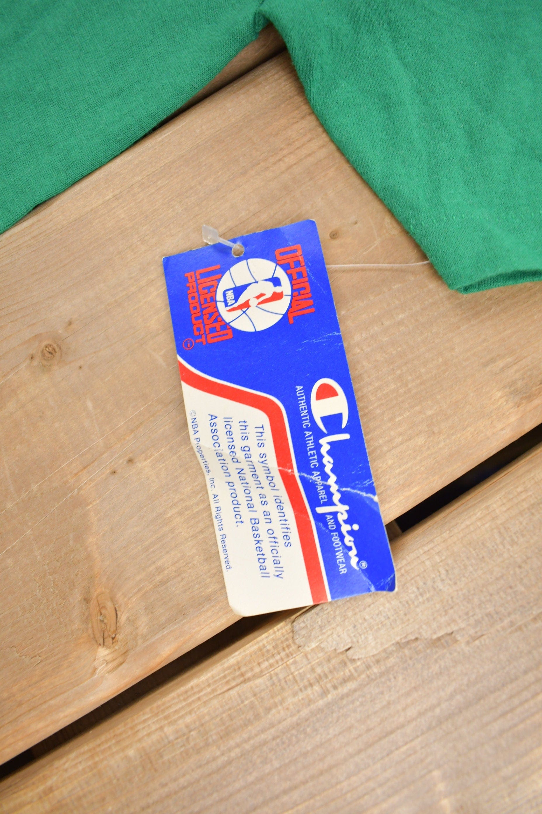 Proper Vintage Clothing > Gender Neutral Adult Clothing > Tops & Tees > T Shirts Vintage 1980s Deadstock Boston Celtics NBA Champion T-Shirt / Made In USA / Single Stitch / NBA Basketball / New With Tags / Sportswear