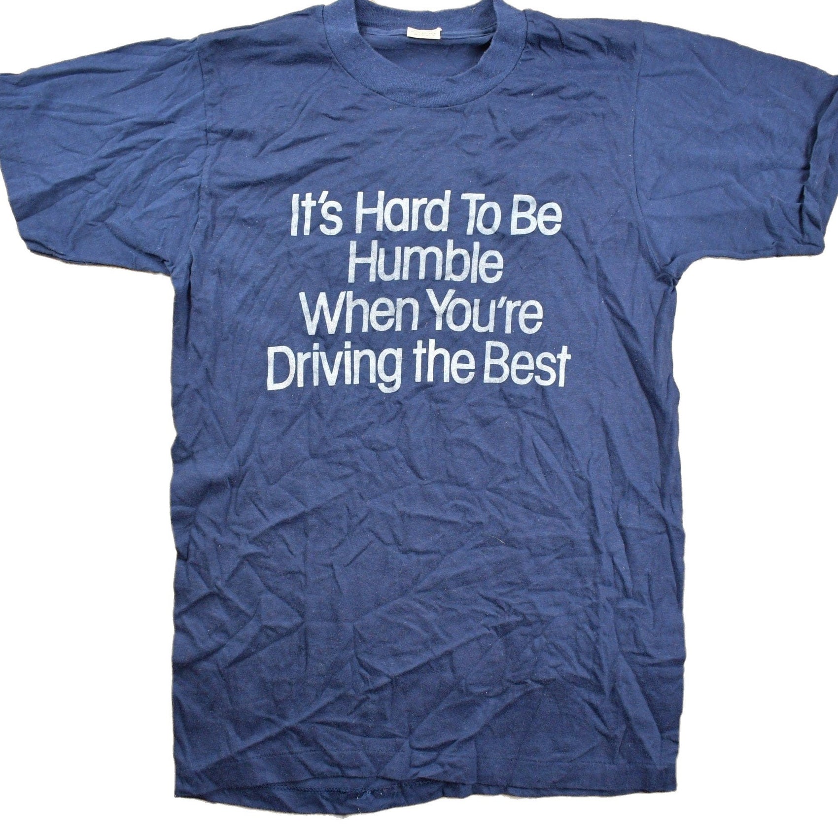 Proper Vintage Clothing > Gender Neutral Adult Clothing > Tops & Tees > T Shirts Vintage 1980s "Its Hard To Be Humble When You're Driving The Best" Graphic T Shirt / Vintage T Shirt / Single Stitch / Made In USA