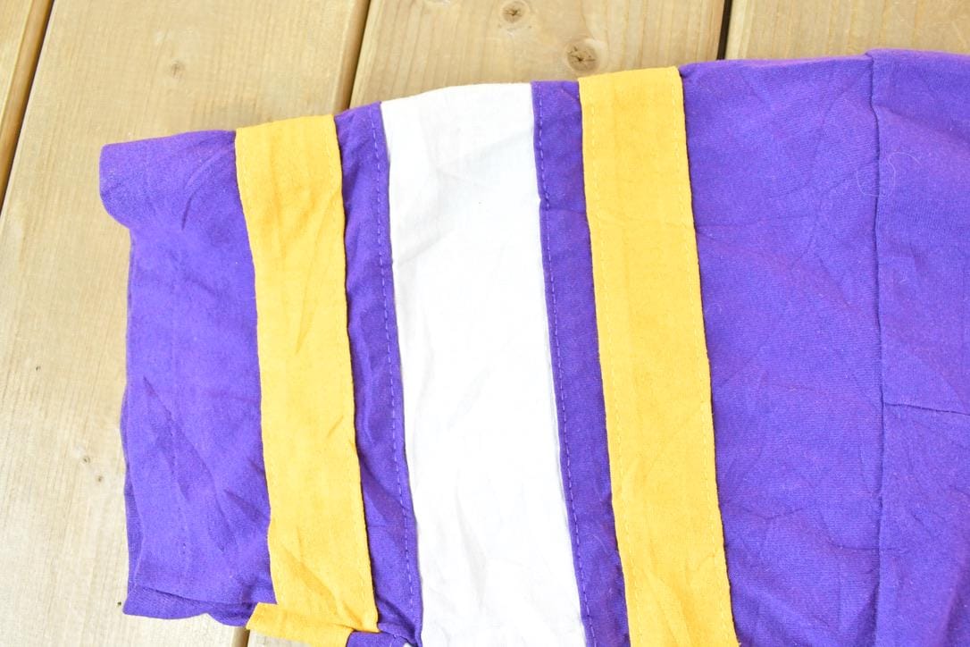 Proper Vintage Clothing > Gender Neutral Adult Clothing > Tops & Tees > T Shirts Vintage 1980s Minnesota Vikings NFL Graphic T-Shirt / Logo 7 Made In USA / Single Stitch / NFL / 90s Streetwear / Sportswear